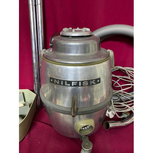 291 - Vintage Nilfisk GA 70 vacuum cleaner complete with attachments and fully working