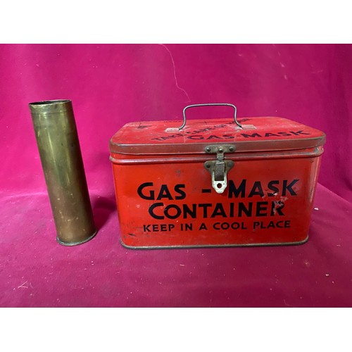 323 - A military gas mask tin and brass shell