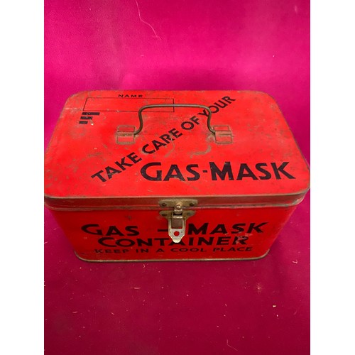 323 - A military gas mask tin and brass shell