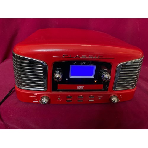 329 - Retro style Classic radio/CD/ record player in red. One lid hinge missing