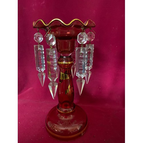 931 - Pair of cranberry candlesticks with clear glass drops. 23cms