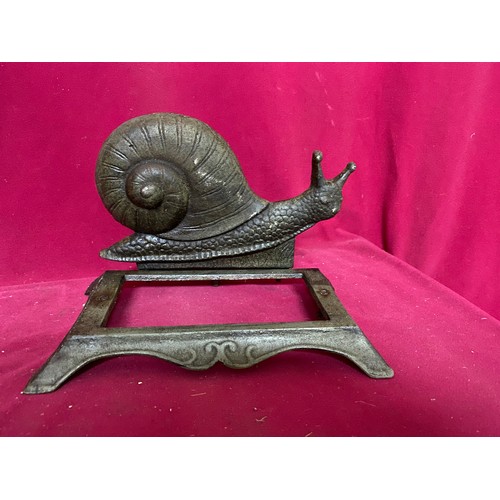 935 - Selection of metal ware including miners lamp, Man doorstop, shop bell and Snail. Man is 40cms tall