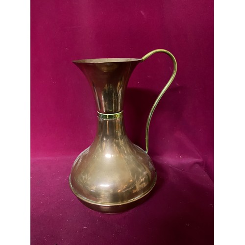 663 - 2 copper jugs measuring 50 cms tall and 26 cms tall