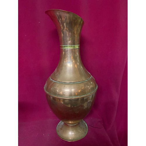 663 - 2 copper jugs measuring 50 cms tall and 26 cms tall