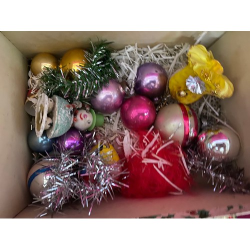 679 - Selection of vintage Christmas ornaments and box of vintage crackers.