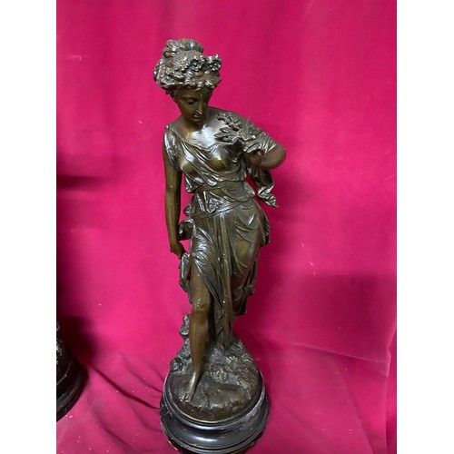 686 - A pair of early 20th century spelter figures as classical maidens, Duo and Idylle, each on turned wo... 