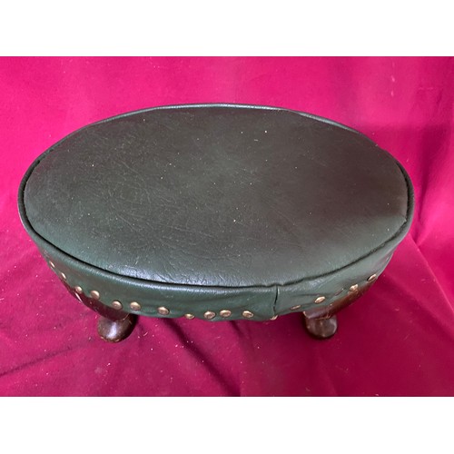 696 - Antique leather covered footstool