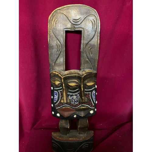 718 - 2 wooden African masks with largest measuring 63 cms tall