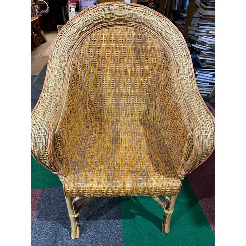 719 - Cane armchair and wicker table