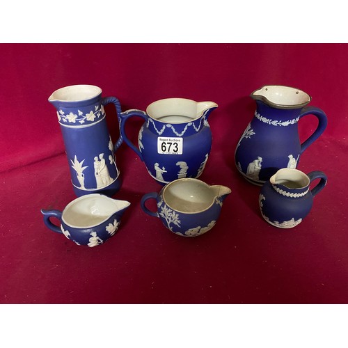 673 - Selection of 6 Cobalt blue jasperware jugs of various sizes