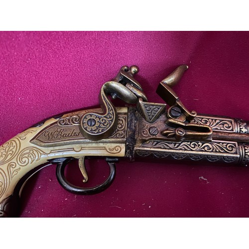 644 - Double barrelled replica flintlock pistol. In single trigger, over and under format with extensive e... 