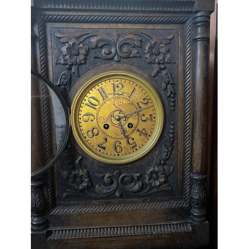 641 - Grandmother longcase clock measuring 167 cms tall with gold tone face and decorative carvings to top