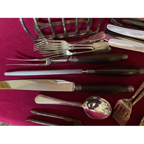521 - Selection of EPNS cutlery, toast rack and carving set