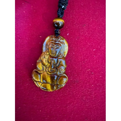 534 - Mini car pendant on chain and Tigers Eye chinese figure pendant.