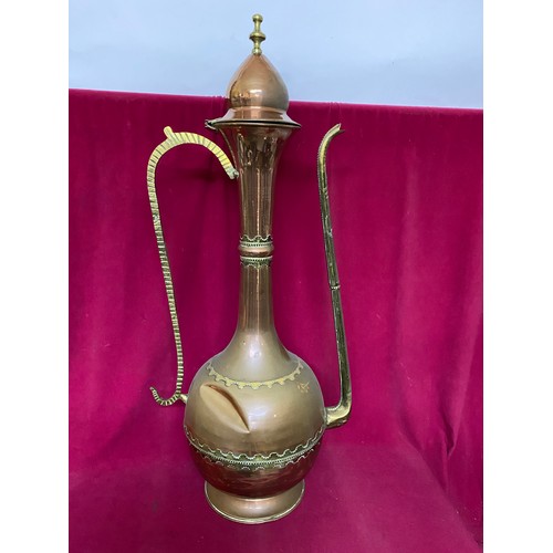 541 - Large brass and copper Turkish decanter/pot measuring 96 cms tall, some dents to body