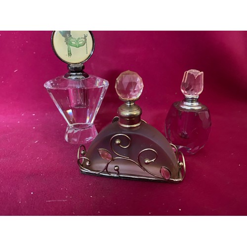 579 - 2 Dressing table hand mirrors and 1 brush with 3 perfume bottles. Matching set of mirror and brush w... 