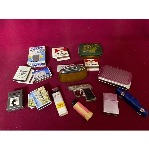 410 - Collection of novelty lighters, cigarette cases, matches and other tobacciana