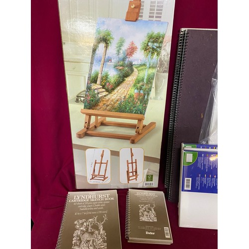 604 - Selection of Art Materials including water colour paper, boxed wooden table easel, 3 canvas frames, ... 