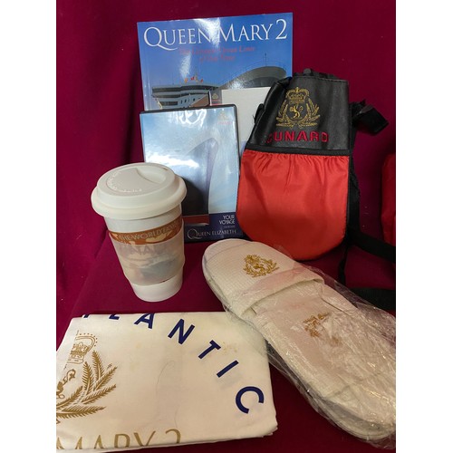 616 - Queen Mary II holdall including ceramic travel mug, photo frame, coolbag, slippers and T-towel.