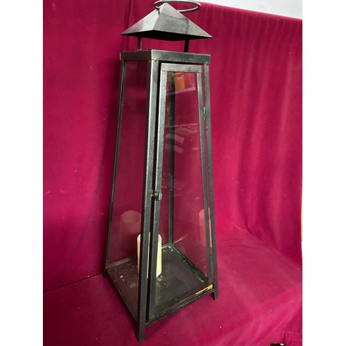 652 - Large metal and glass candle holder 74cms tall