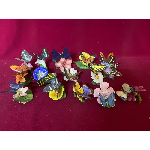 654 - Selection of ceramic flowers with butterflies.