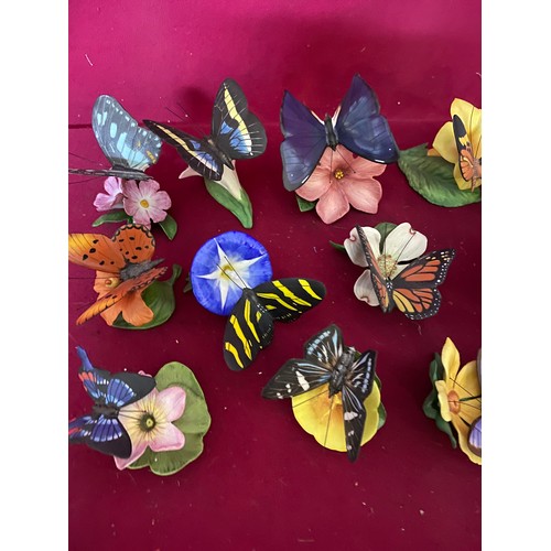 654 - Selection of ceramic flowers with butterflies.