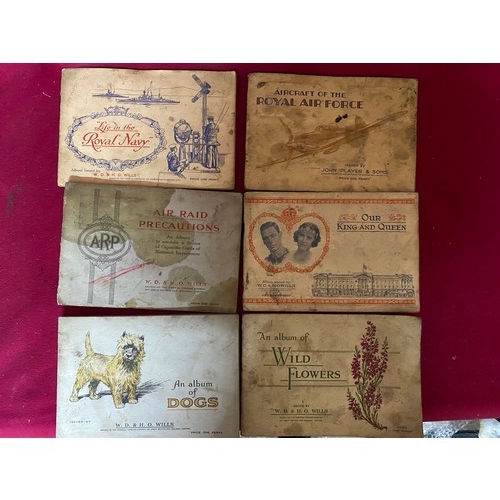 650 - W.D & H.O. Wills cigarette card books from Air Raid precautions, Royal Navy and RAF.