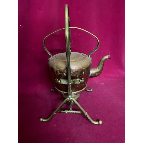 687 - Antique copper and brass kettle on stand