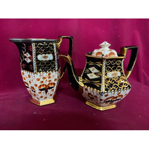 696 - Imari style teapot, water jug and milk jug