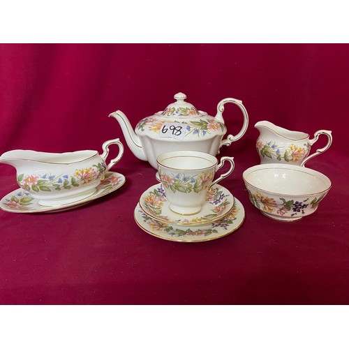 698 - Paragon teaset comprising of tea pot, gravy boat, milk jug and sugar bowl, 9 dessert bowls, 8 cups a... 