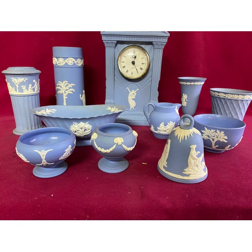 174 - Selection of 11 pieces of blue Wedgewood jasperware, vases, bell, bowls and a clock