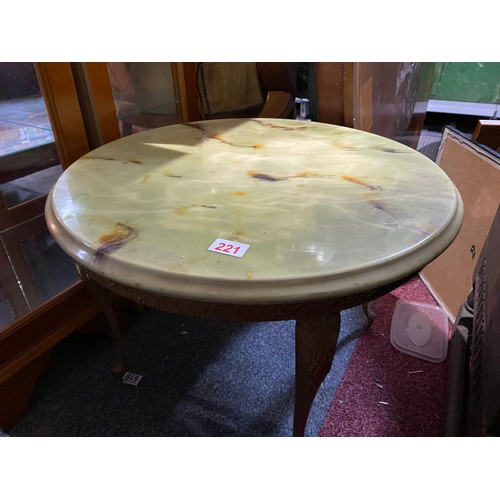 221 - Brass and onyx style table measuring 60cms diameter