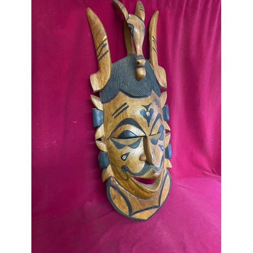 229 - African wooden tribal mask measuring 78 cms tall