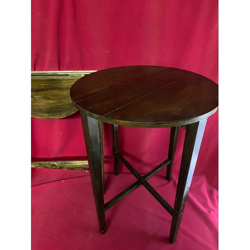 329 - A pair of folding coffee tables measuring 38 cms diameter