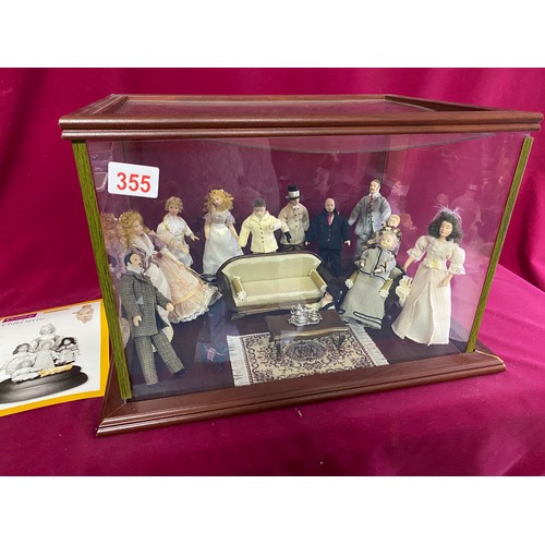 355 - 'Scenes of Victorian life' figurines of living room in display cabinet measuring 41 x 30 x 30 cms ta... 