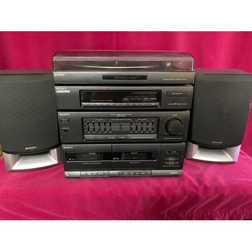 362 - Sony stereo system with radio,  twin cassette player, record deck and 2 Sharp speakers.