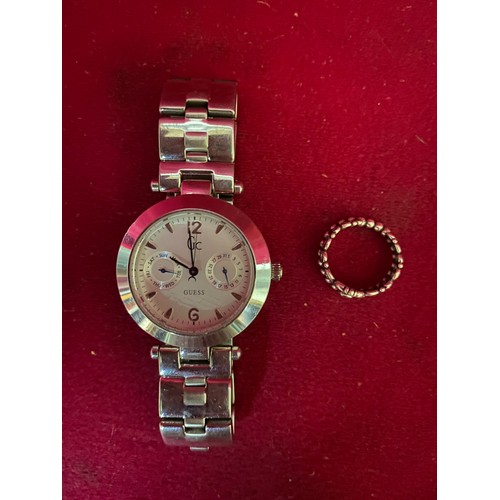 280 - A ladies Guess chronograph watch and a Pandora silver Tiara ring