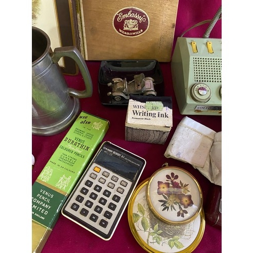 363 - Assortment of vintage curios including stapler, lamp, tape measure and table mats.