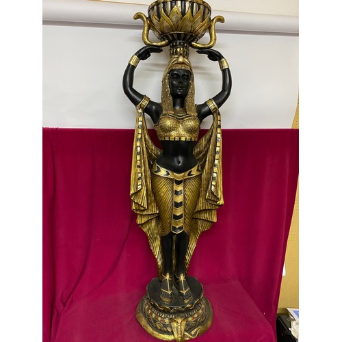 102 - Egyptian style figure of woman holding bowl in black and gold. 135cms tall