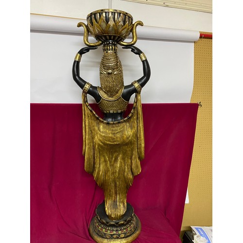 102 - Egyptian style figure of woman holding bowl in black and gold. 135cms tall