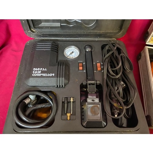 500 - A Busybody 260 psi case compressor and boxed heavy duty jump leads