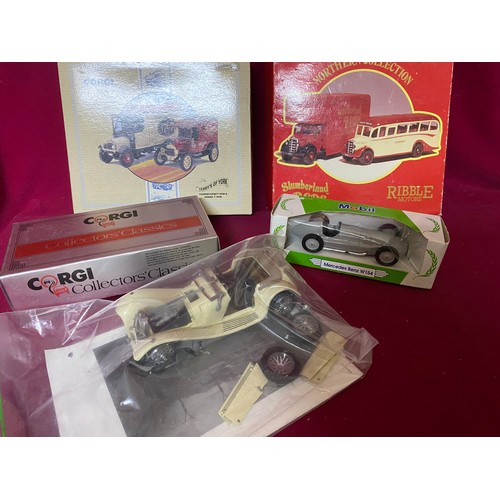 411 - Collection of boxed and loose diecast cars and trucks.