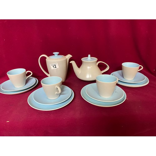 12 - Poole twin tone coffee set comprising 2 x coffee pots long and short spout and 4 x trios