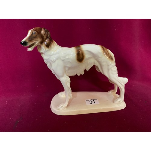 31 - Porcelain figurine of greyhound by A Hertwig & Co. standing 22 cms tall