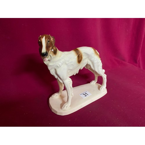 31 - Porcelain figurine of greyhound by A Hertwig & Co. standing 22 cms tall