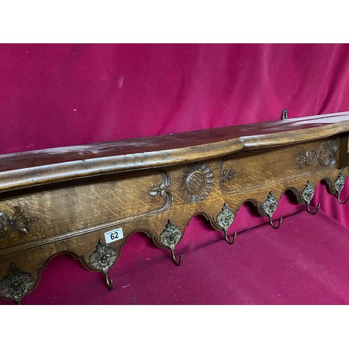 62 - Ornate hand decorated coat plate rack measuring 135 cms long