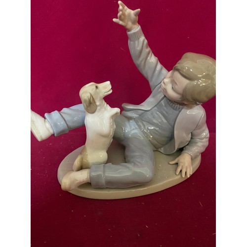 67 - 3 pieces of Nao, A 1990 Nao by Lladro 'Boy with dog' no.278 figurine, a Nao duck standing 15 cms tal... 