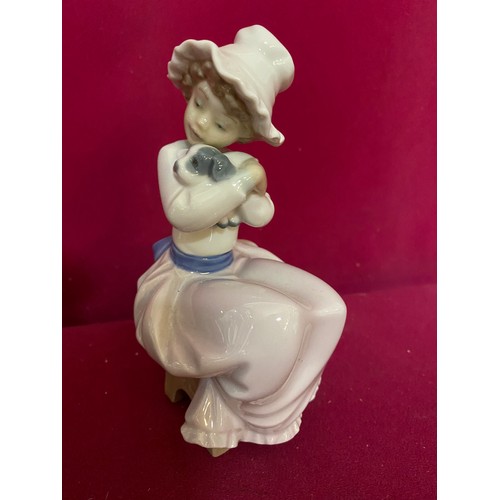 67 - 3 pieces of Nao, A 1990 Nao by Lladro 'Boy with dog' no.278 figurine, a Nao duck standing 15 cms tal... 