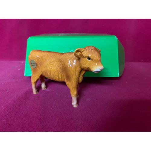 73 - Beswick Highland calf in original box, slight chip on ear