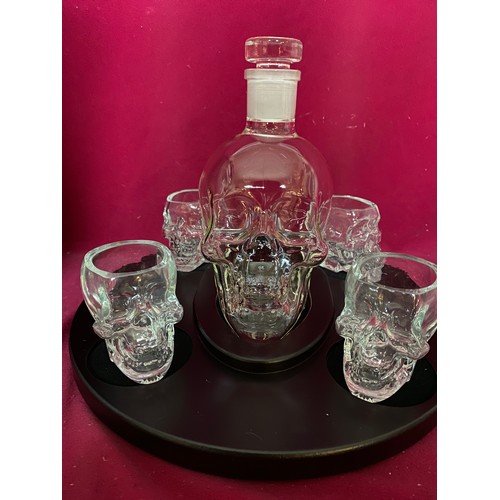 241 - Skull decanter and 4 glasses on black tray, as new in box.